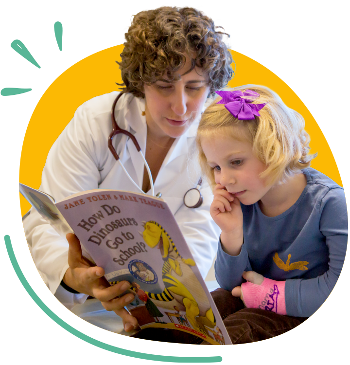 Doctor and Child Reading Together